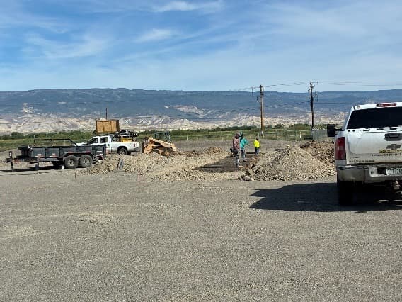 A crew excavating and preparing the foundation for the expanded lumber racks