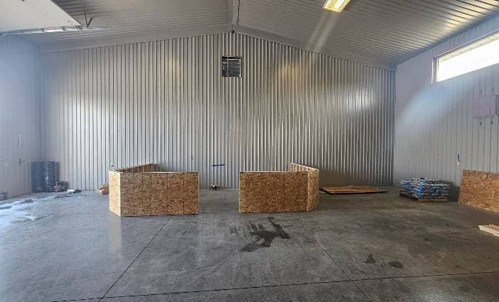 The open retail space with the sheathed sales counter sections set in place