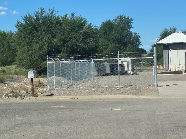 Completed chain-link fencing securing the new site