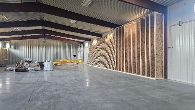 Interior wall framing taking shape inside the warehouse